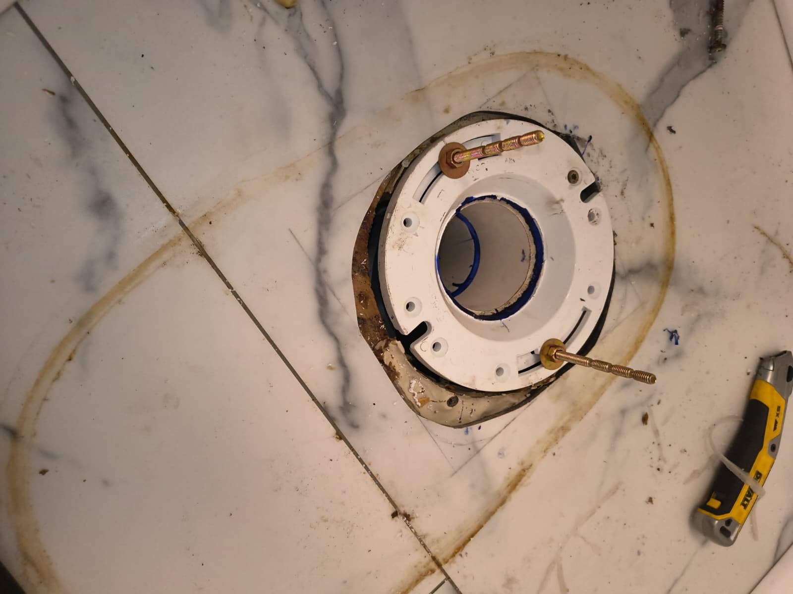 Close-up of toilet flange with old wax ring residue in Palm Harbor, FL 34684 during replacement.
