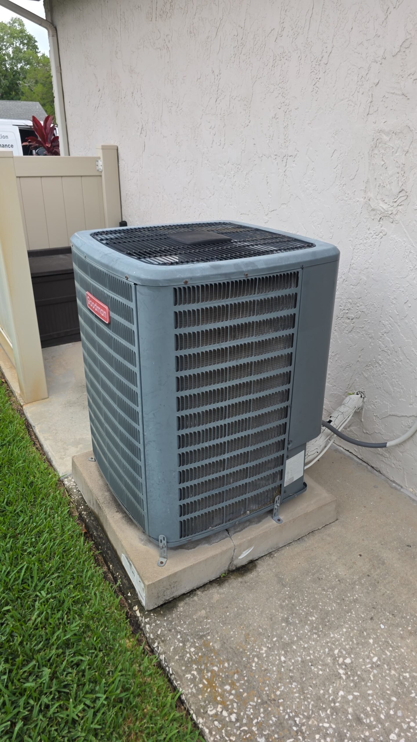 Newly installed outdoor AC unit on concrete pad in Palm Harbor, FL 34684 after Premium Therapy Plan 2.0.