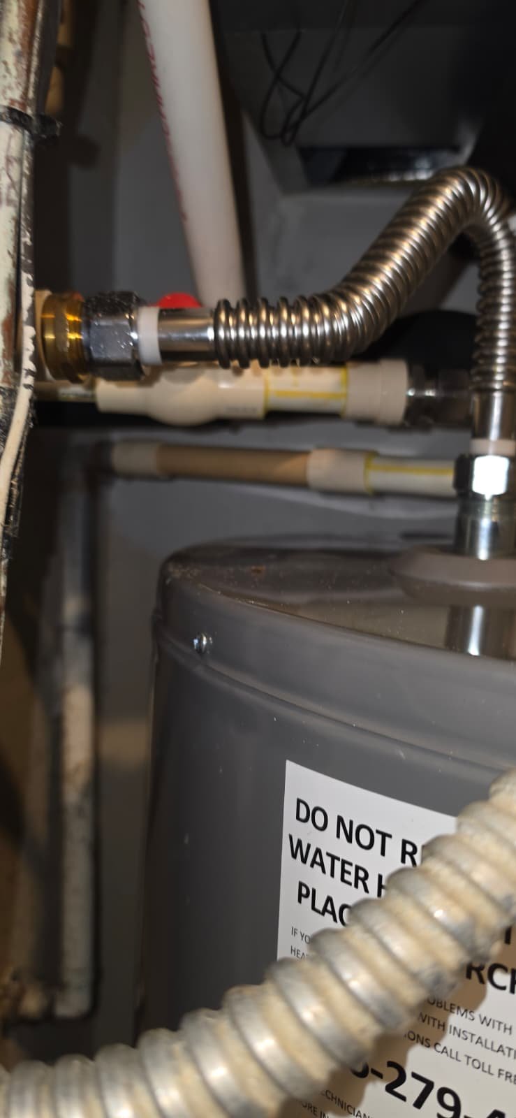 Close-up of plumbing on water heater, Brandon, FL 33511. Equipment view.