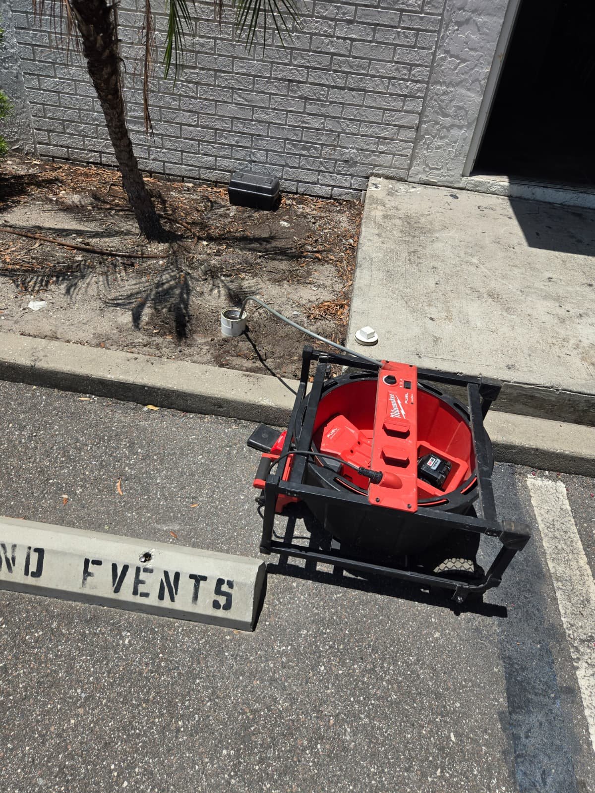 Plumbing equipment on a parking lot surface, Tampa, FL 33605.