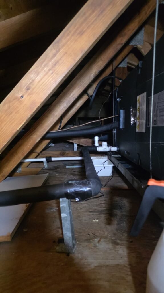 In-progress PVC drain line repair in attic, St. Petersburg, FL 33703.