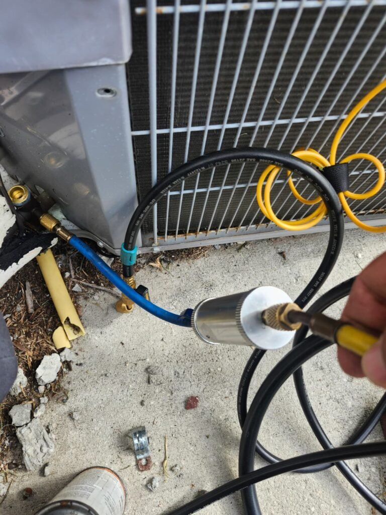 Refrigerant lines connected to AC unit during service in Lutz, FL 33558.