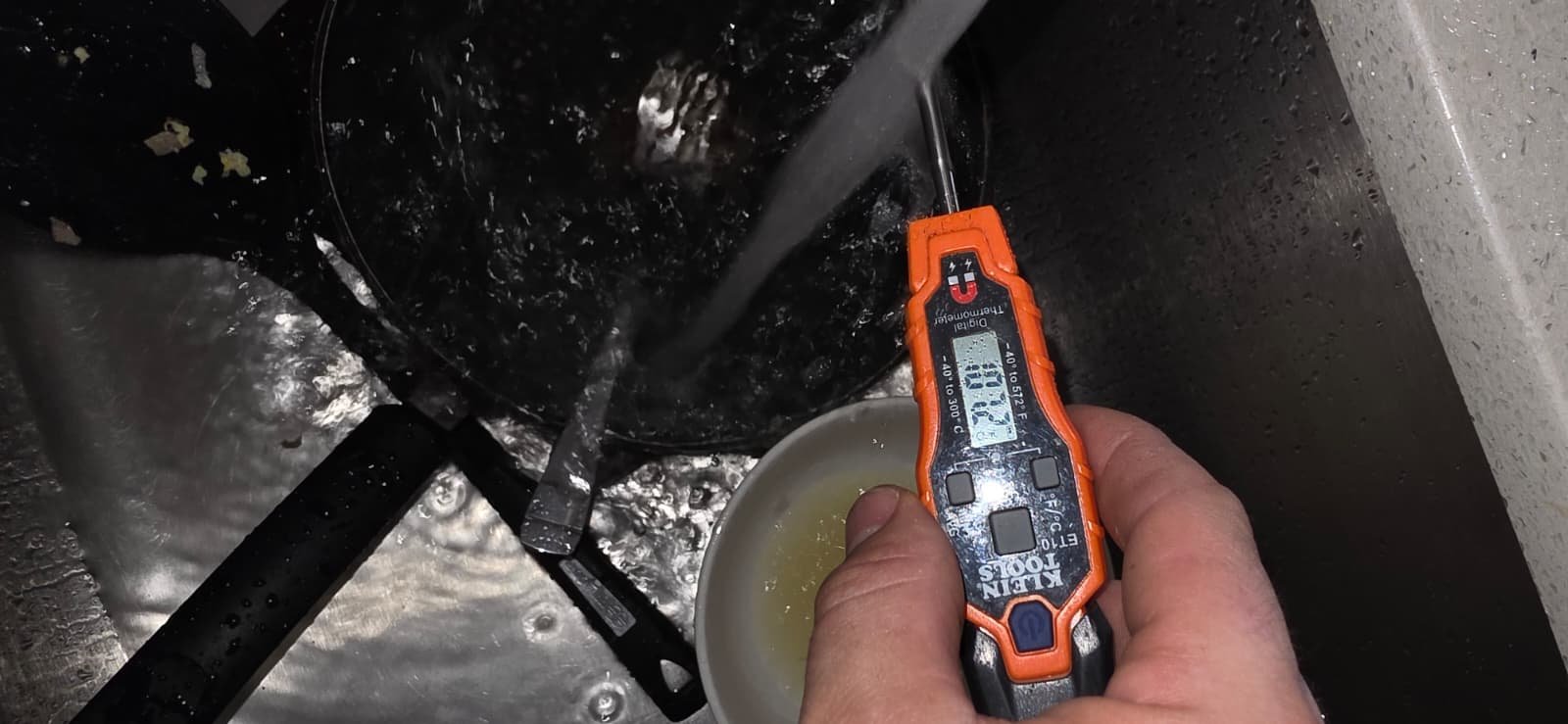 Digital thermometer checking water temperature in sink, Brandon, FL 33511.