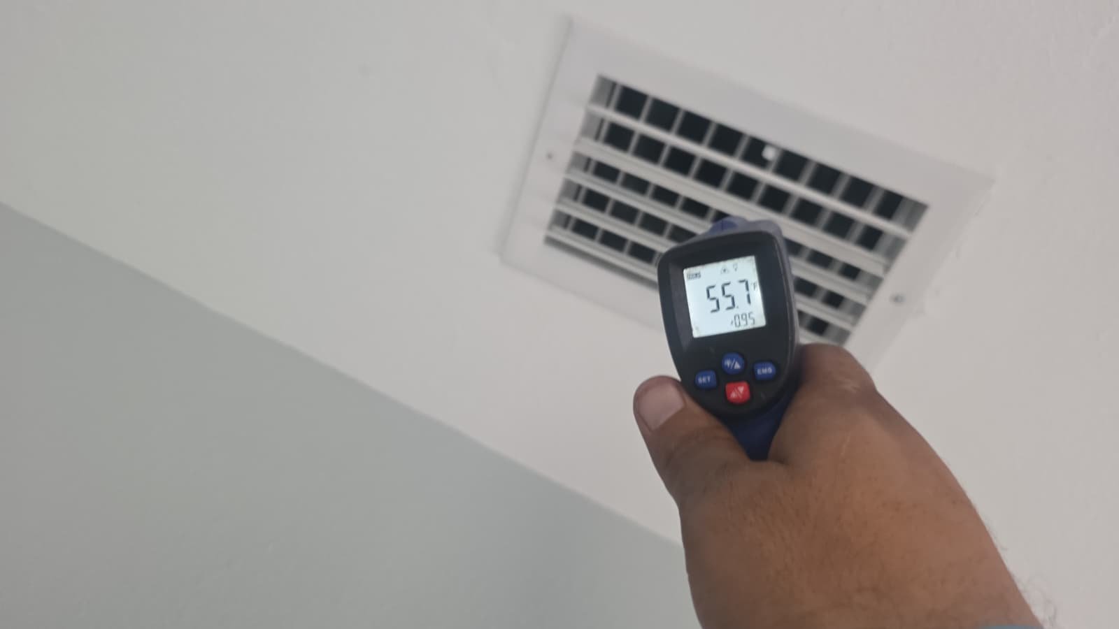 Infrared thermometer reading near ceiling vent in St. Petersburg, FL 33710.