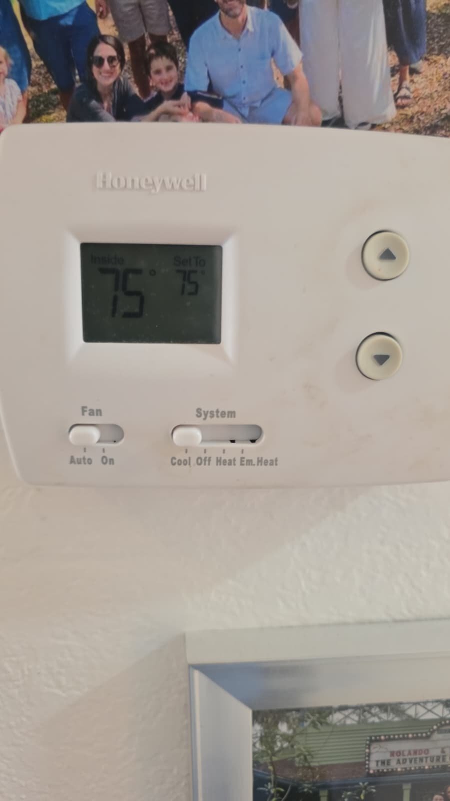 Thermostat showing temperature settings on wall in St. Petersburg, FL 33703.