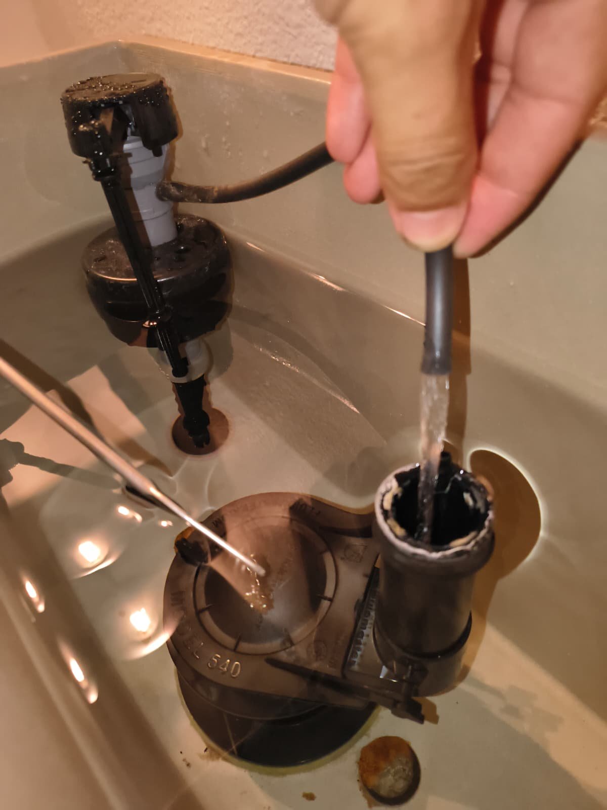 Toilet Fill Valve Work in Brandon, FL 33511 Working on toilet fill valve with water flow in Brandon, FL 33511.