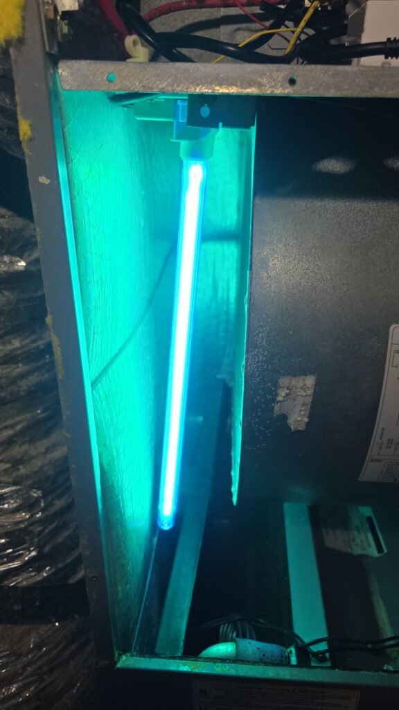 A UV light glowing inside an air handler in Tampa, FL 33615.