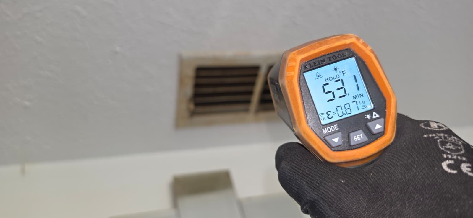 Vent Temperature Check - Tampa, FL 33611 Infrared thermometer showing temperature reading at a vent in Tampa, FL 33611.