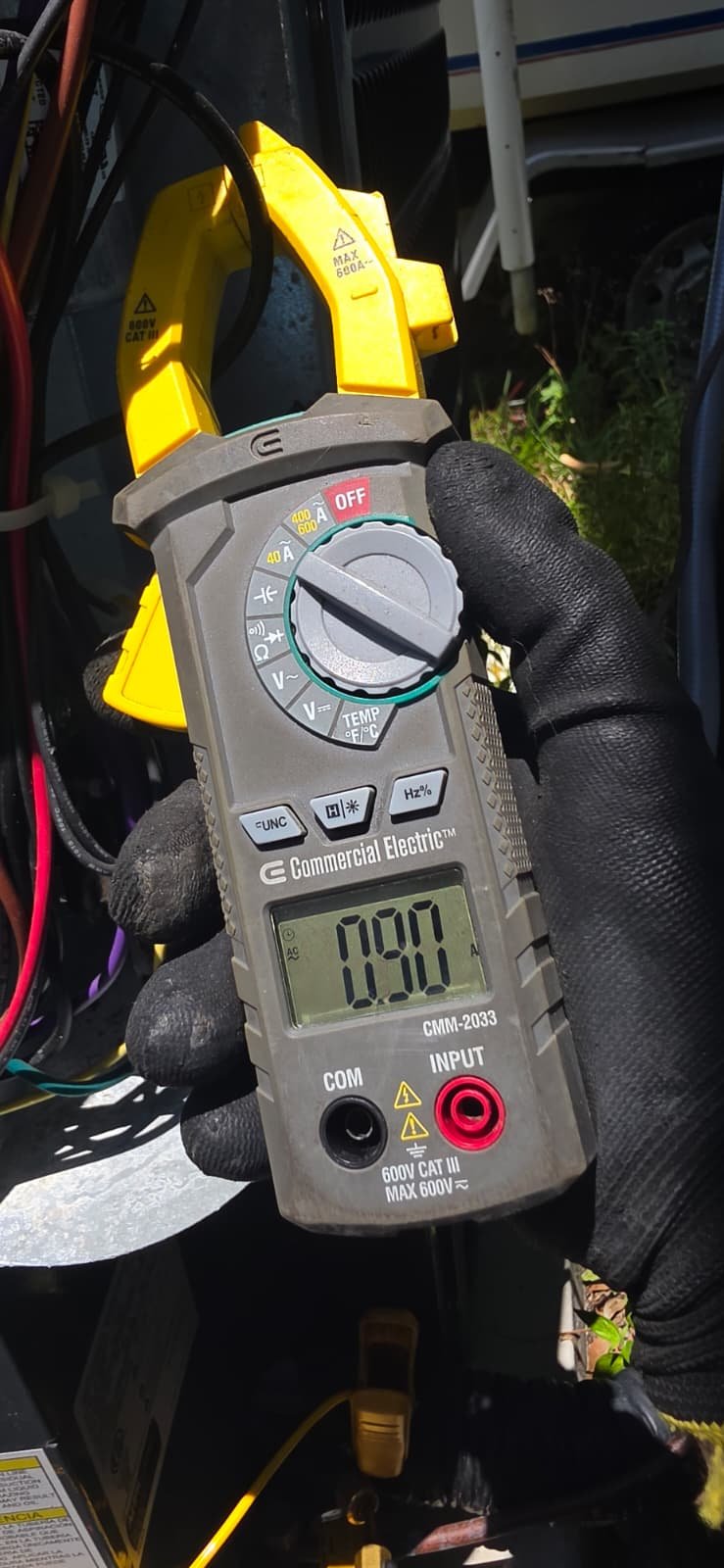 Voltage Check - Tampa, FL 33611 Multimeter showing voltage reading near HVAC equipment in Tampa, FL 33611.