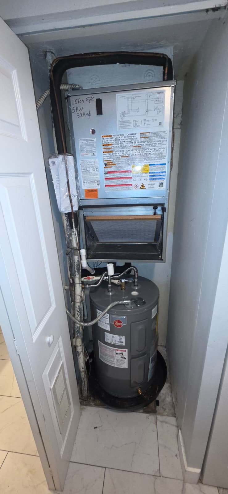 Installed water heater and air filter in small space, Brandon, FL 33511.