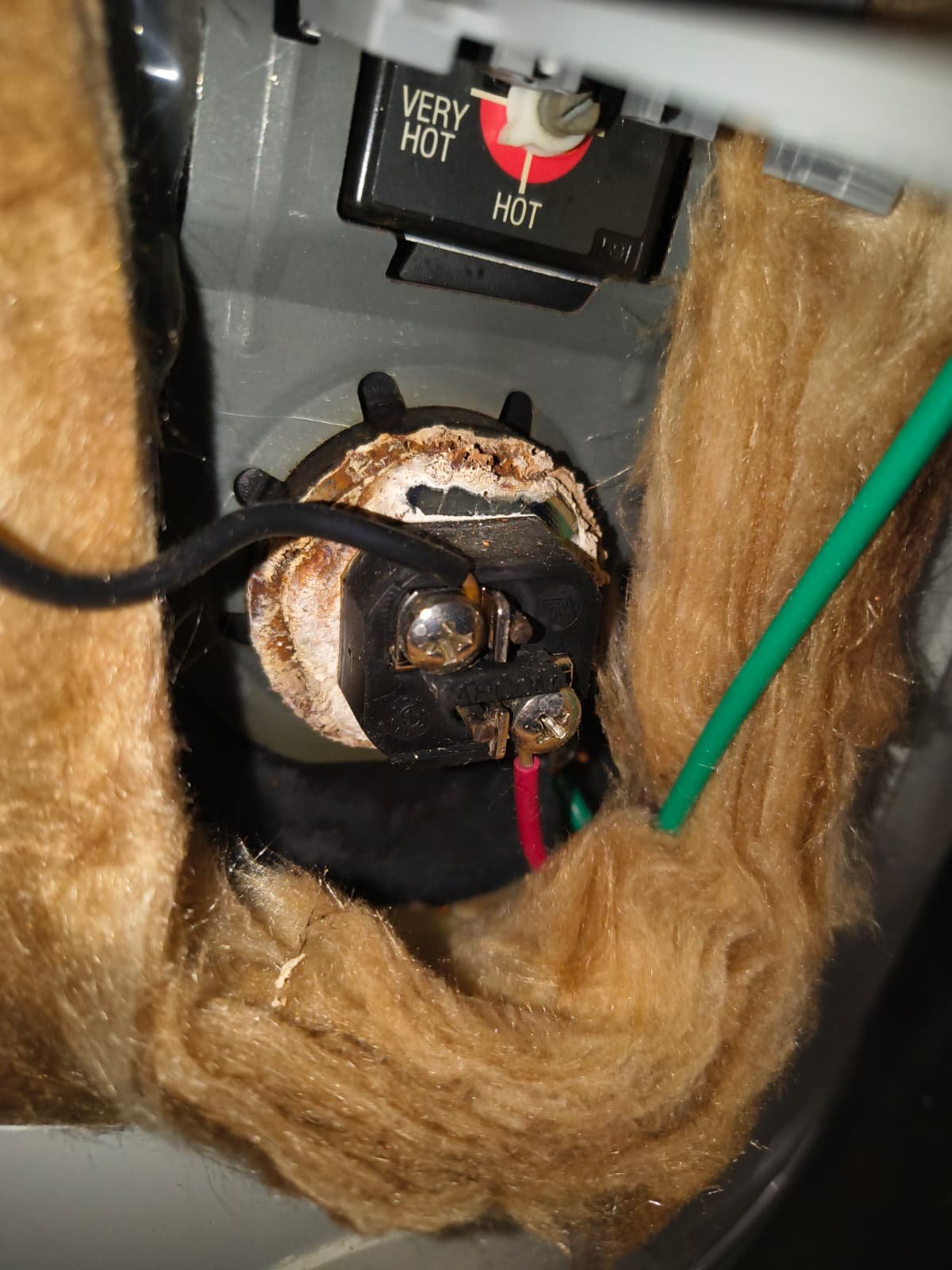 Close-up of water heater wiring and insulation, Riverview, FL 33579.