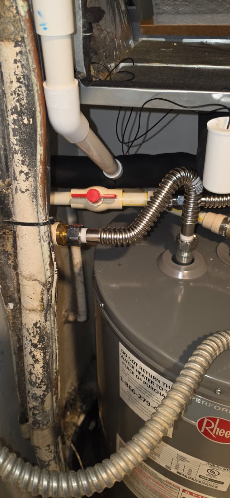Close-up of water heater plumbing in Brandon, FL 33511. Detail view.