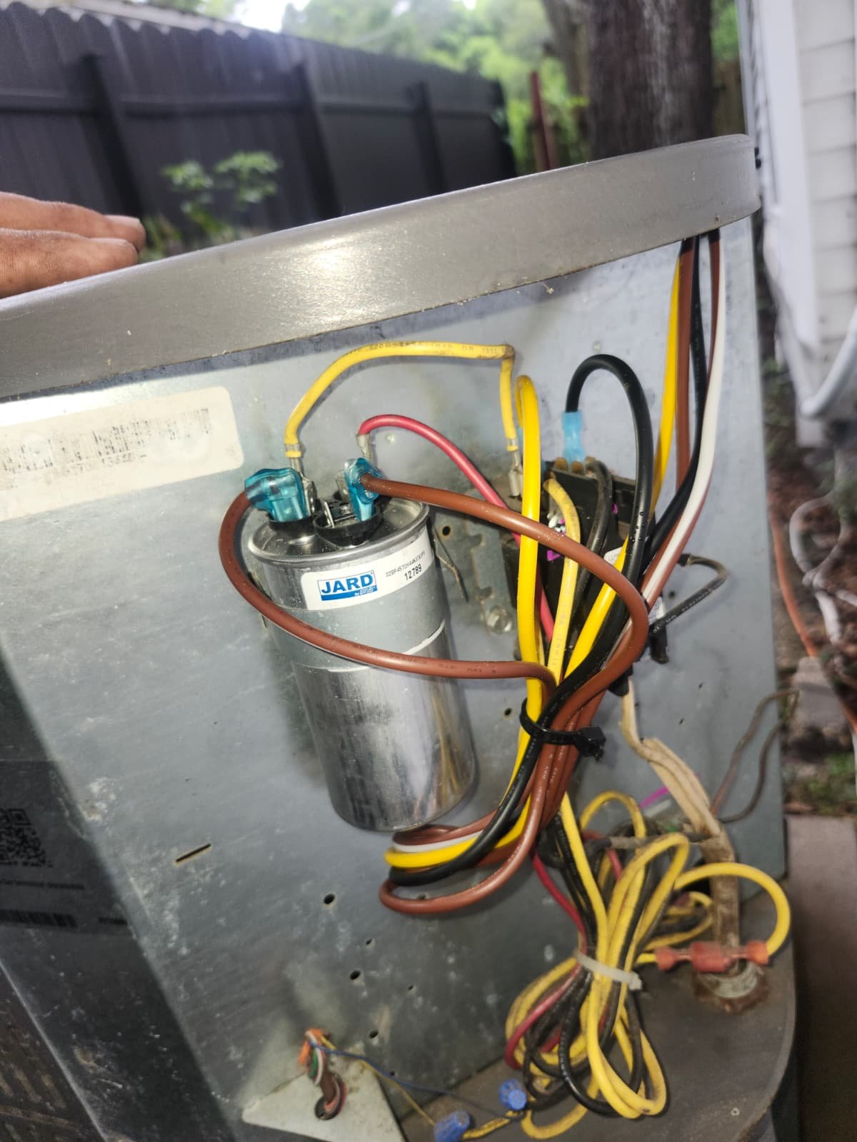 Detailed view of wiring and capacitor in AC unit, Tampa, FL 33604.