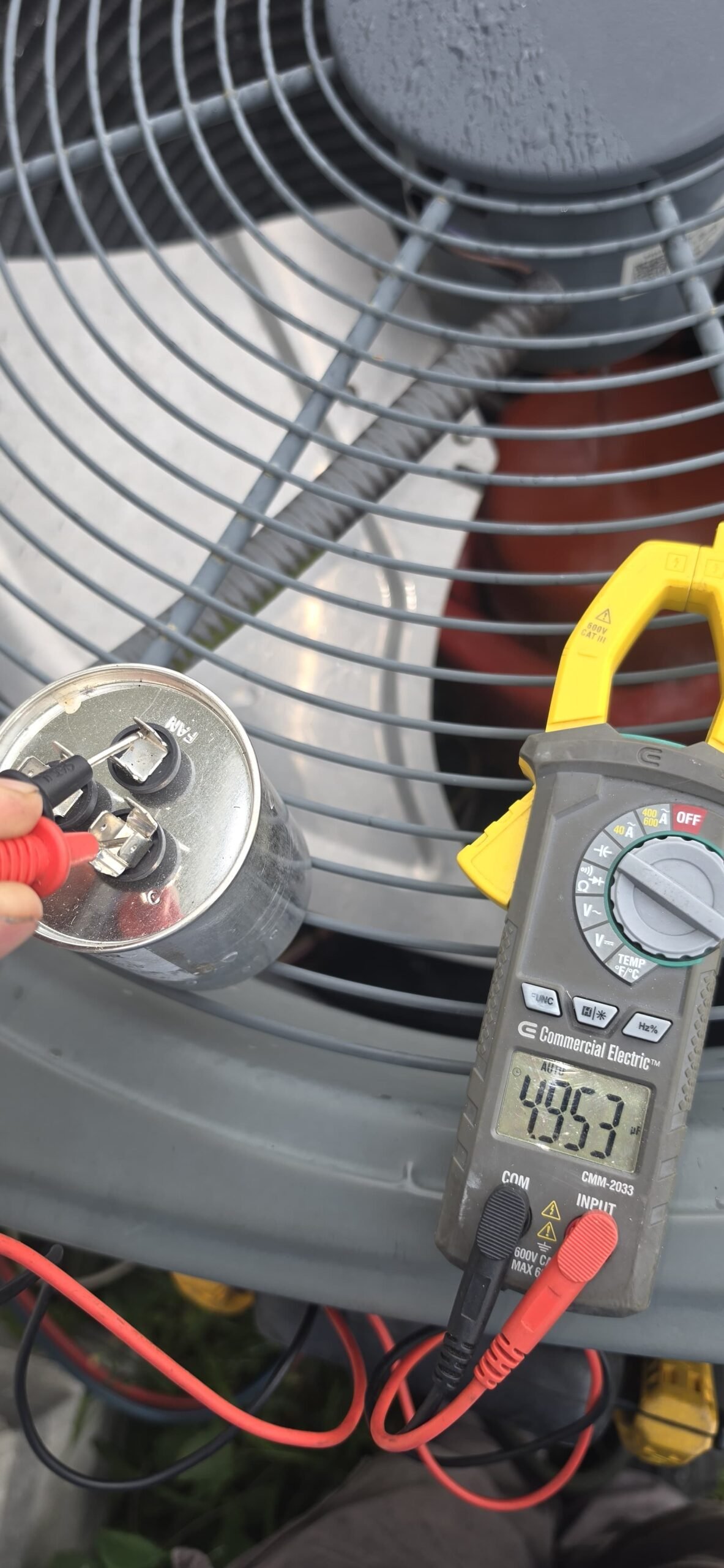 Close-up of multimeter reading on AC unit in Wesley Chapel, FL 33545. Accurate HVAC testing.