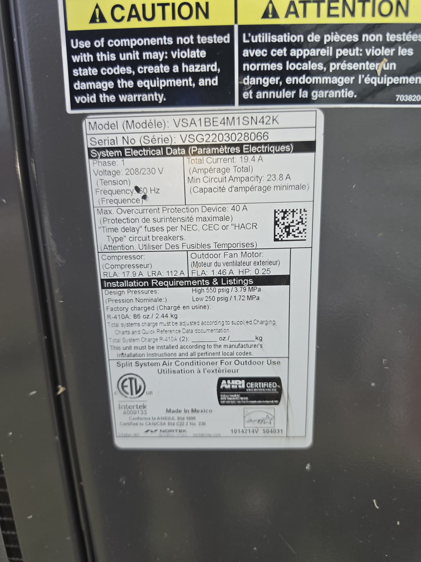 Close-up of AC unit specifications label in Tampa, FL 33605.