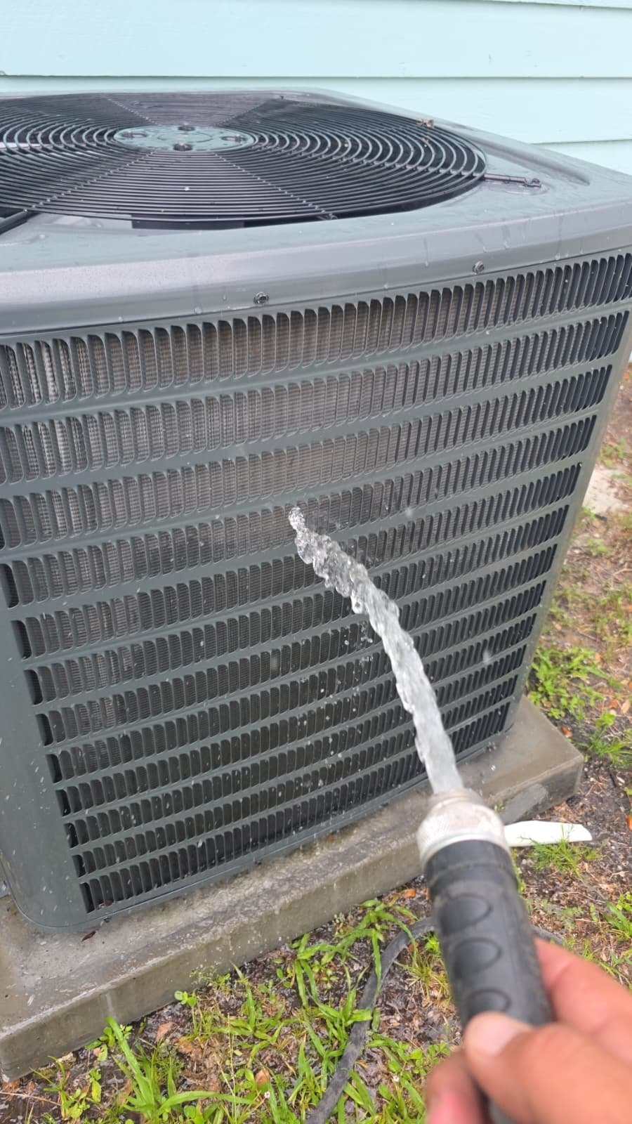 AC Unit Cleaning - Tampa, FL 33616 Water sprayed on AC unit for cleaning, Premium Therapy Plan, Tampa, FL 33616.