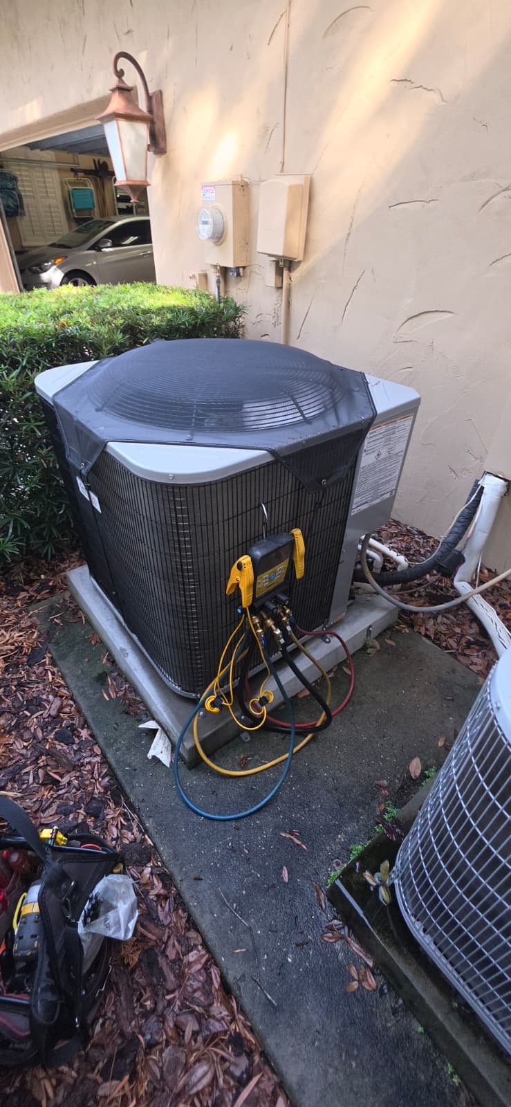 Newly installed AC unit with gauges and hoses in Lutz, FL 33559.