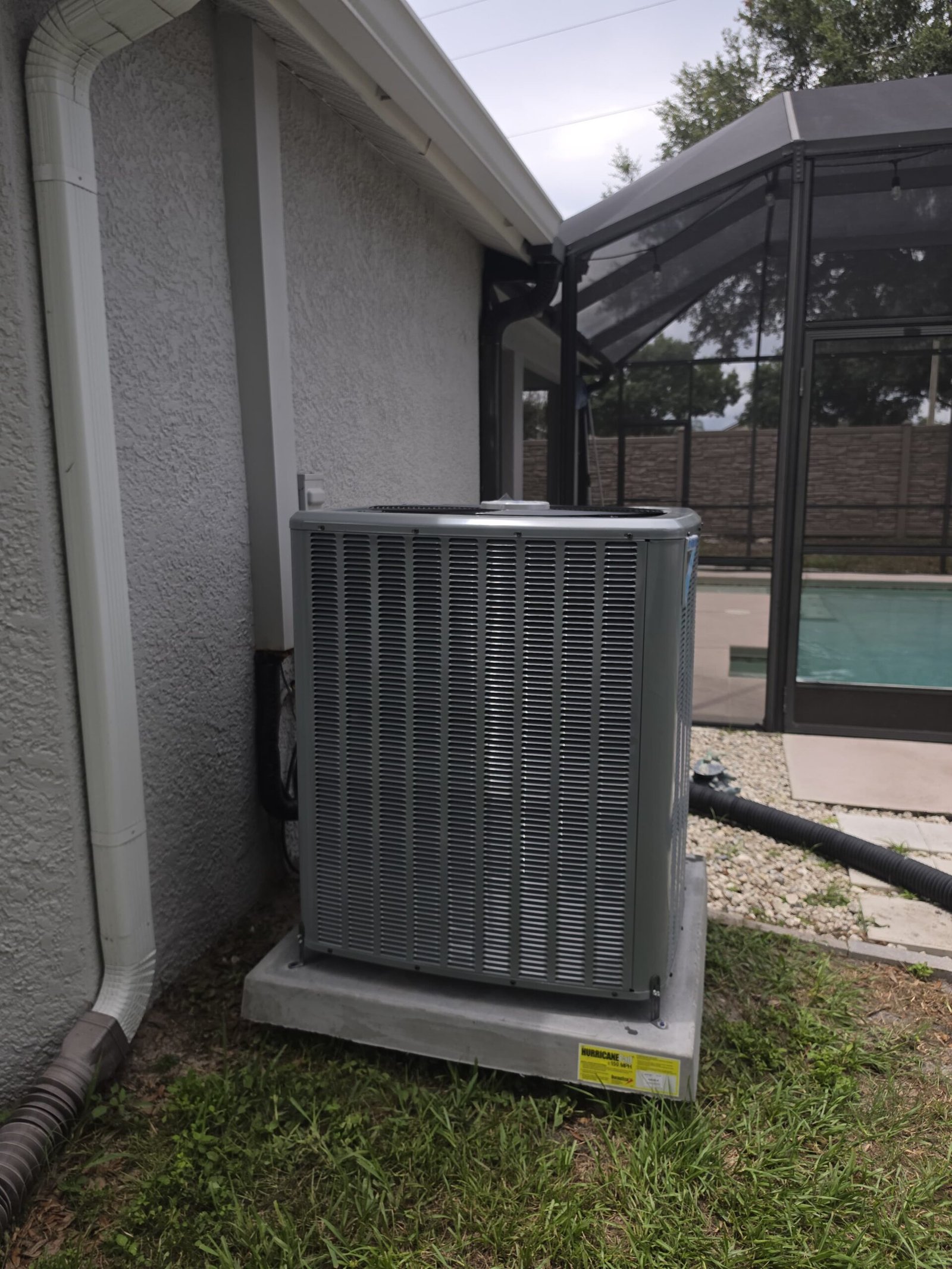 New AC unit beside house near pool, Land O Lakes, FL 34638.