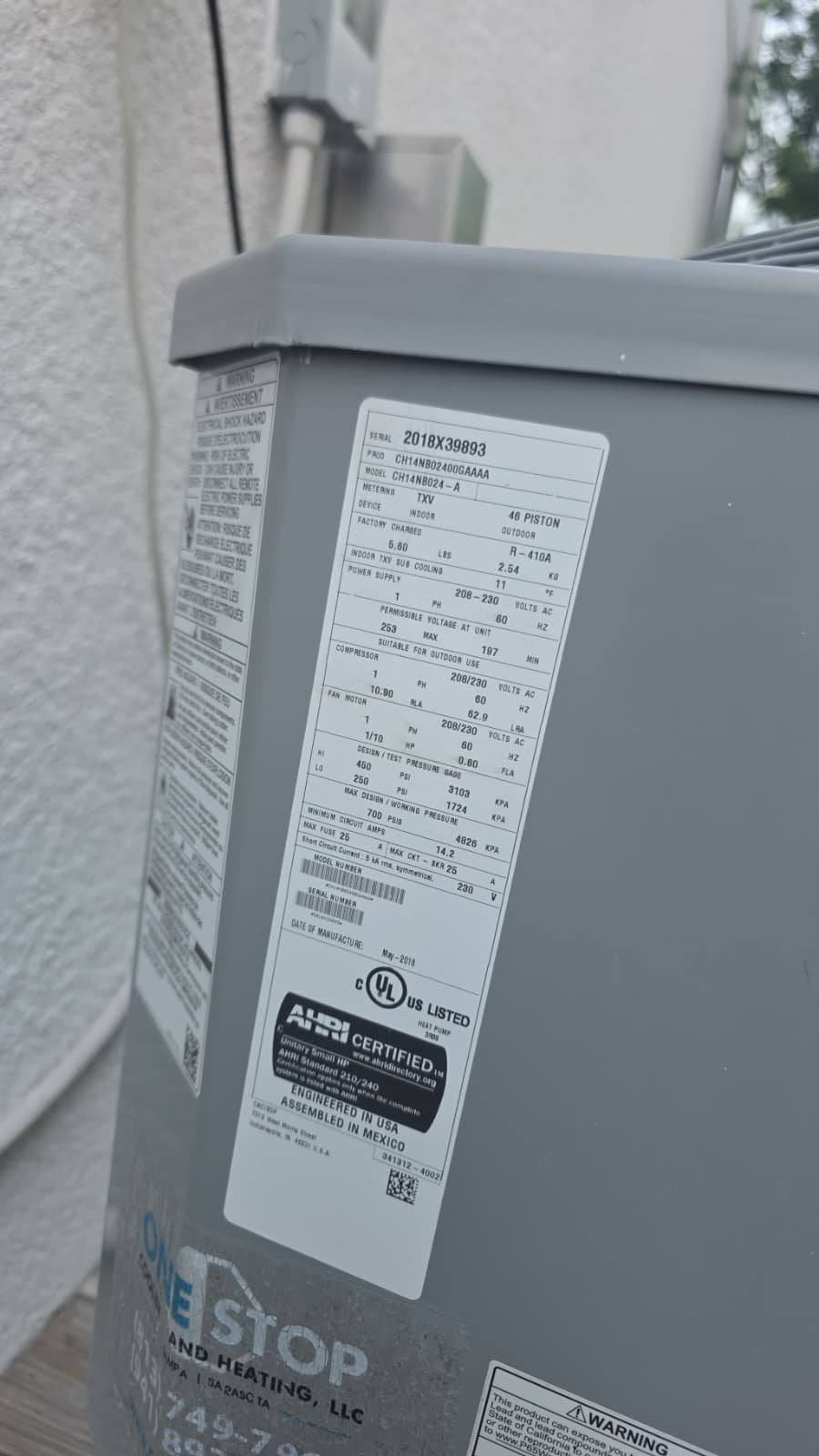 AC Unit Specs Sticker - Tampa, FL 33611 Close-up of technical specifications sticker on outdoor AC unit, Tampa, FL 33611.