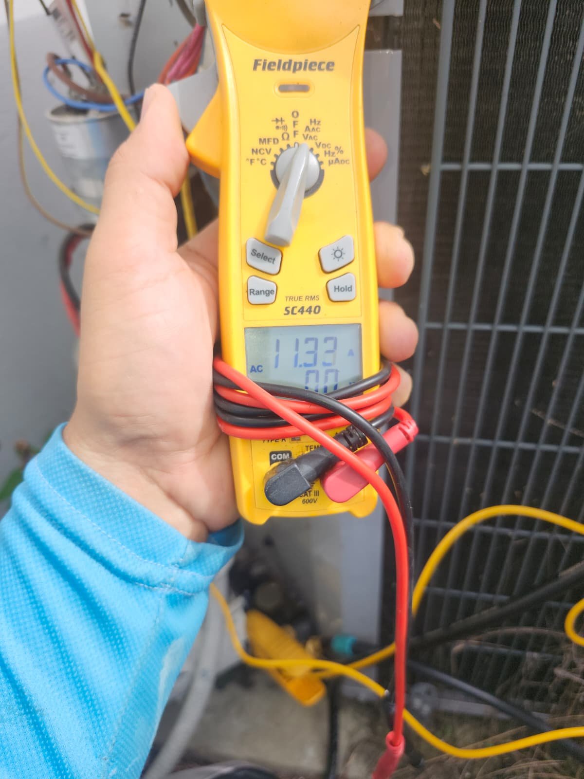 AC Unit Testing - St. Petersburg, FL 33712 Multimeter connected to AC unit, St. Petersburg, FL 33712.