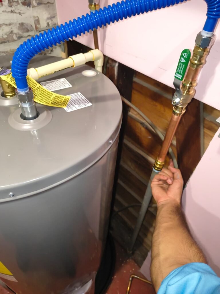 Adjusting Rheem Water Heater Pipes in Tampa, FL 33616 Technician adjusting Rheem water heater pipes in Tampa, FL 33616