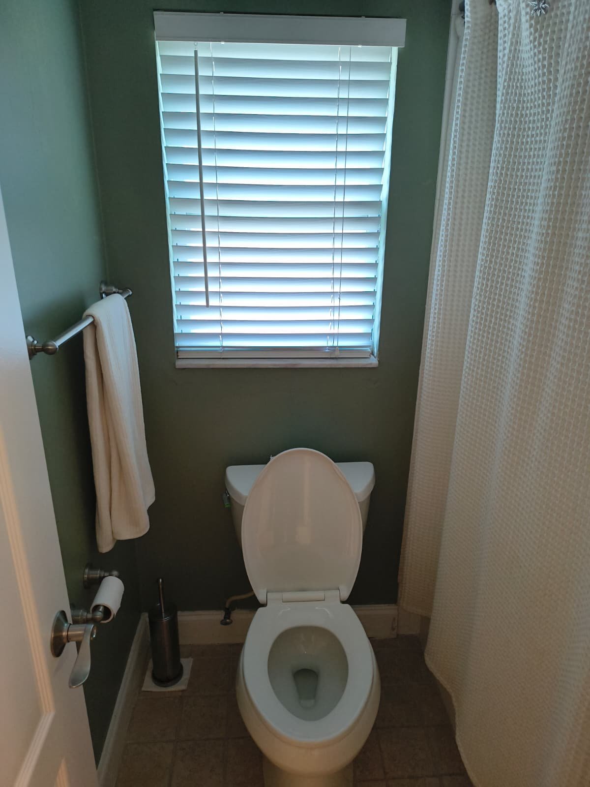Bathroom Interior in Tampa, FL 33635 Bathroom with toilet and shower curtain in Tampa, FL 33635.