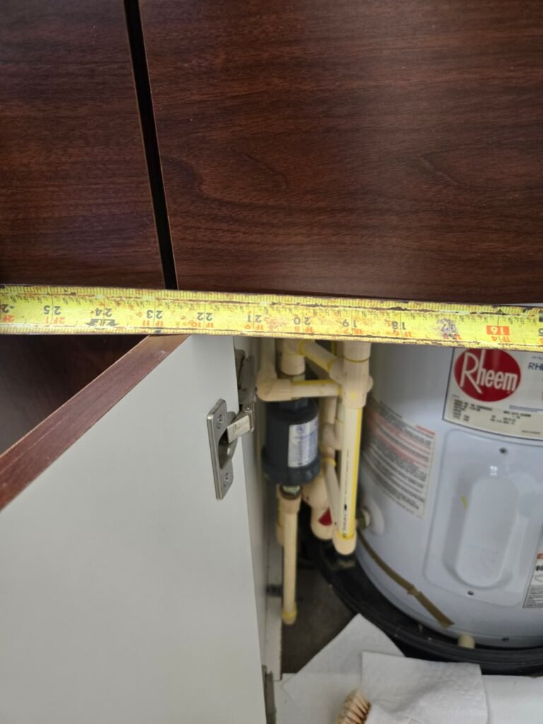 Measuring tape across cabinet in Land O' Lakes, FL 34638
