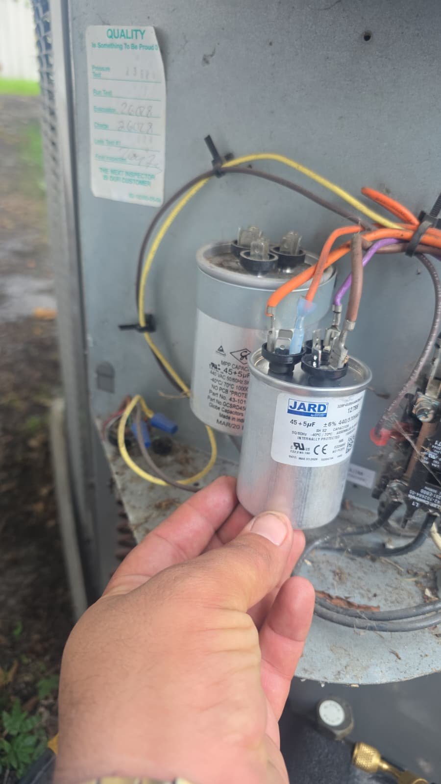 Capacitor Replacement in HVAC Unit - Tampa, FL 33607 Technician replacing capacitor in HVAC unit in Tampa, FL 33607.