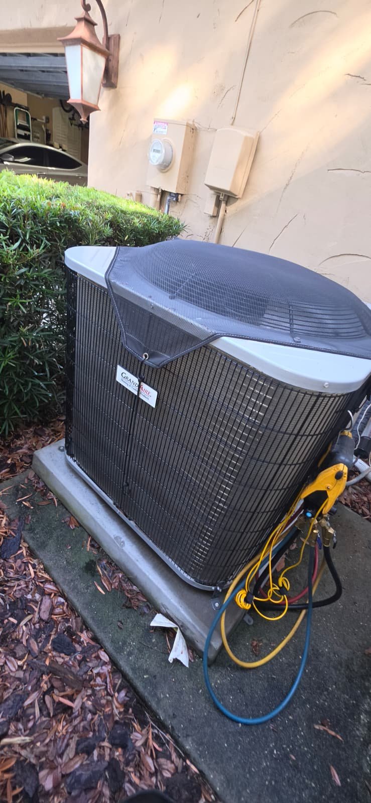 Newly installed Carrier AC unit on concrete pad in Lutz, FL 33559.
