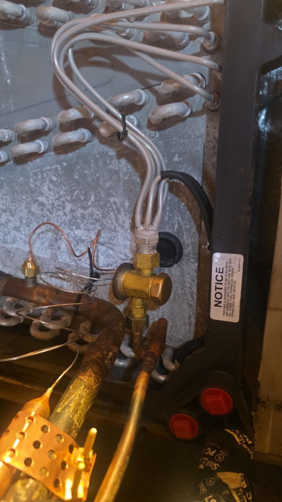 Close-Up of TXV Valve in HVAC - New Port Richey, FL 34655 Close-up of TXV valve and copper lines inside HVAC unit in New Port Richey, FL 34655.