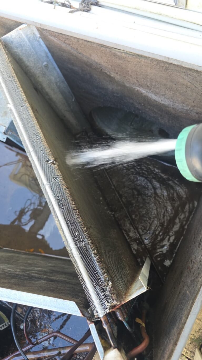 Condenser Coil Cleaning in Thonotosassa, FL 33592 Spraying water on HVAC condenser coil in Thonotosassa, FL 33592