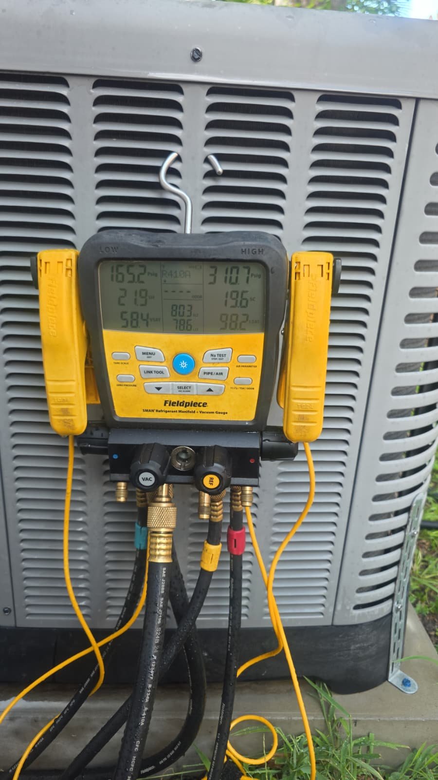 Condenser Diagnostics with Multimeter - Tampa, FL 33607 Fieldpiece multimeter on condenser unit for diagnostics in Tampa, FL 33607.