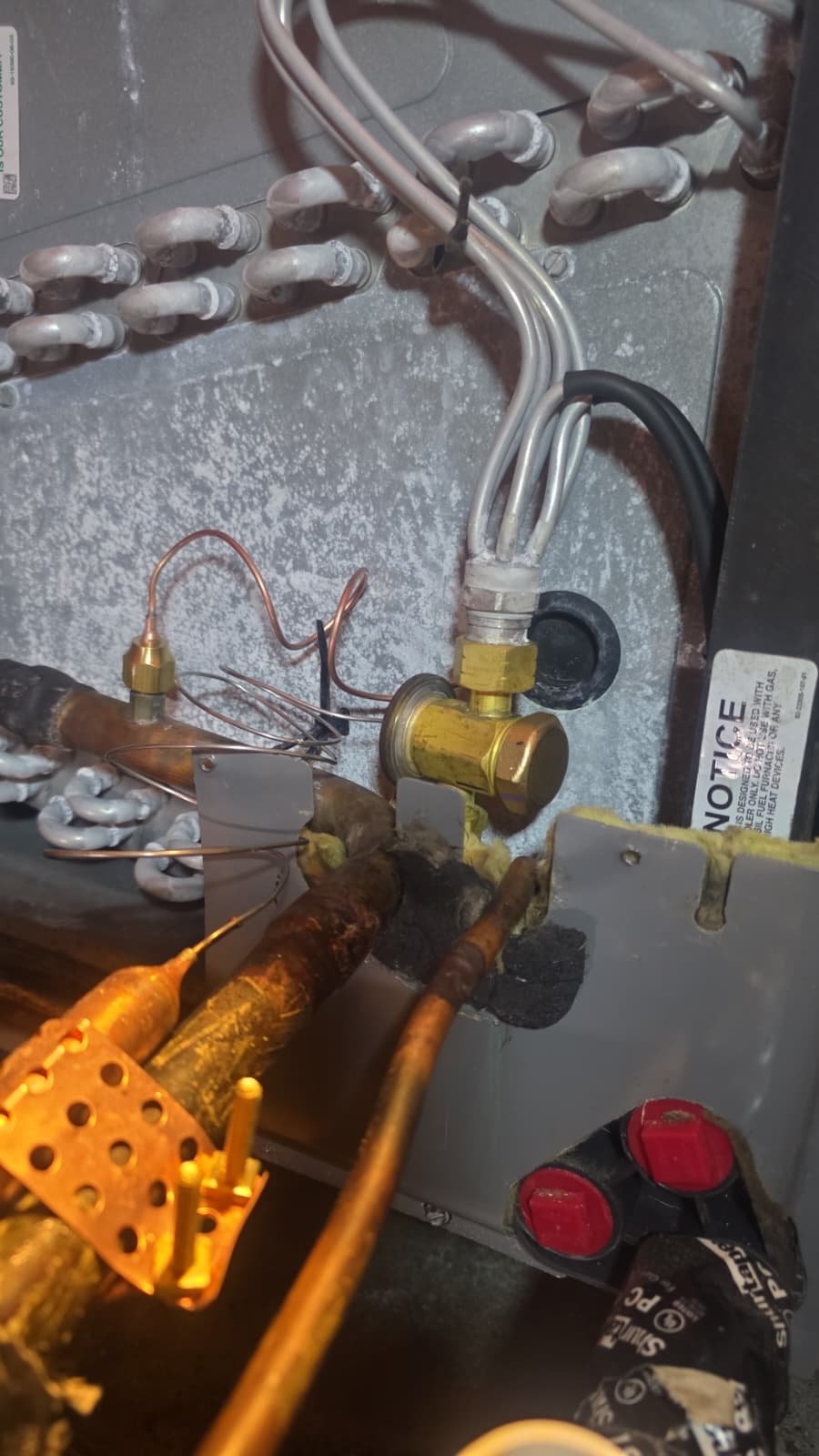 HVAC Copper Lines & TXV Valve - New Port Richey, FL 34655 Copper lines and TXV valve inside HVAC unit during repair in New Port Richey, FL 34655.