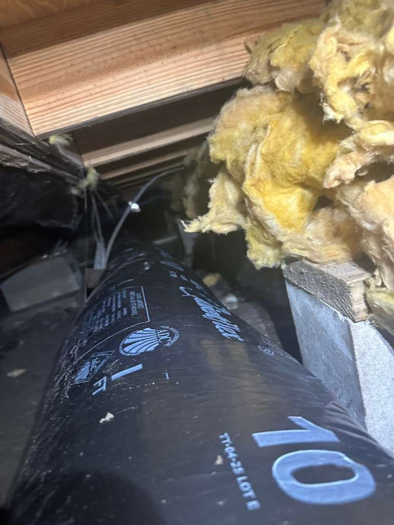 Ductwork installation in crawl space with insulation in Plant City, FL 33565.