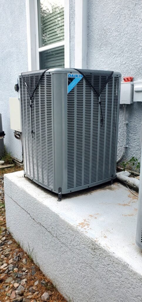 A new 2.5-ton Daikin condenser on a raised pad in Tampa, FL 33616.