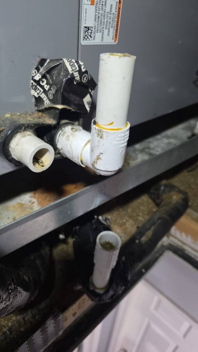 Damaged PVC drain line before repair in Tampa, FL 33603