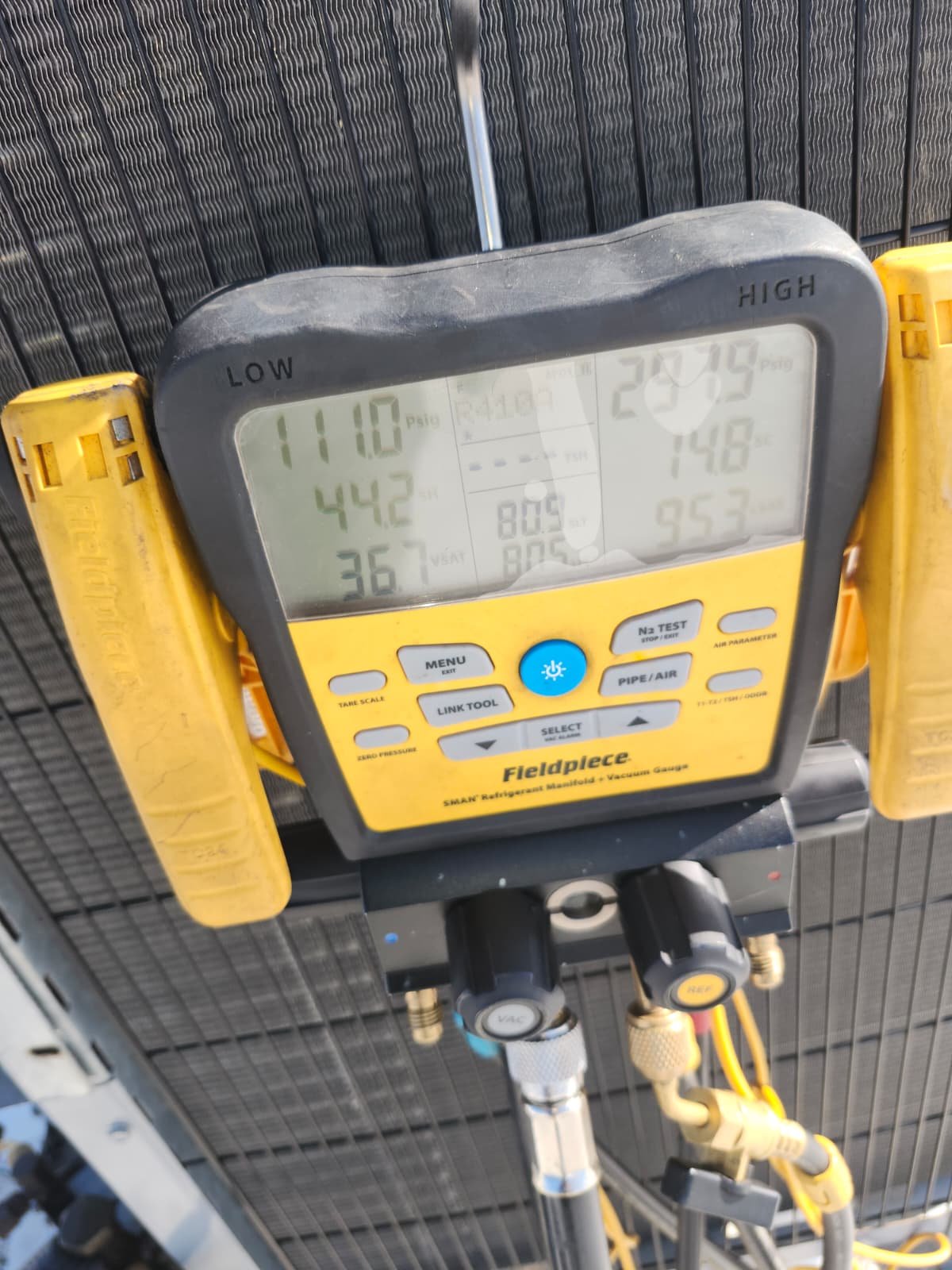 Digital gauge showing pressure and temperature on HVAC in Tampa, FL 33634.