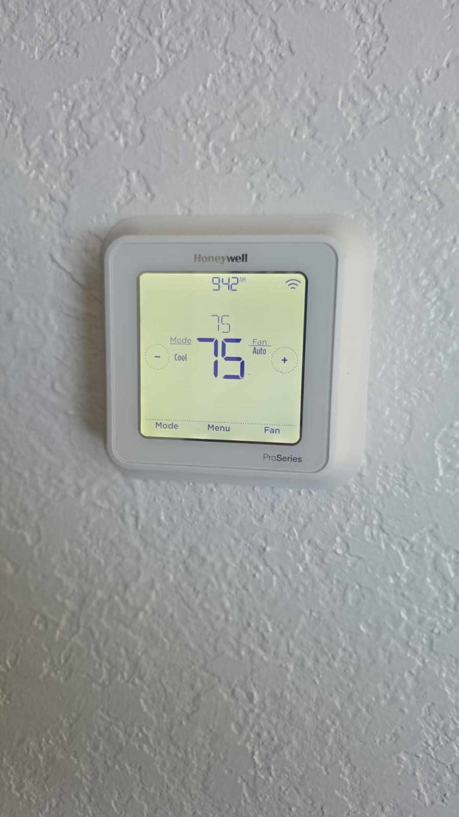 Digital thermostat showing current temperature setting during Premium Therapy Plan in Tarpon Springs, FL 34689.