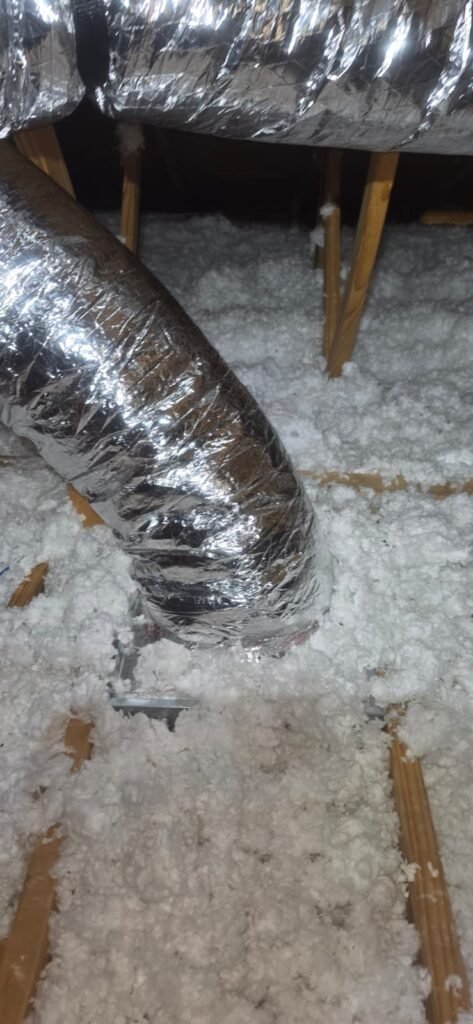 Ductwork and Insulation in Wesley Chapel, FL 33545 Ductwork entering attic insulation, Wesley Chapel, FL 33545