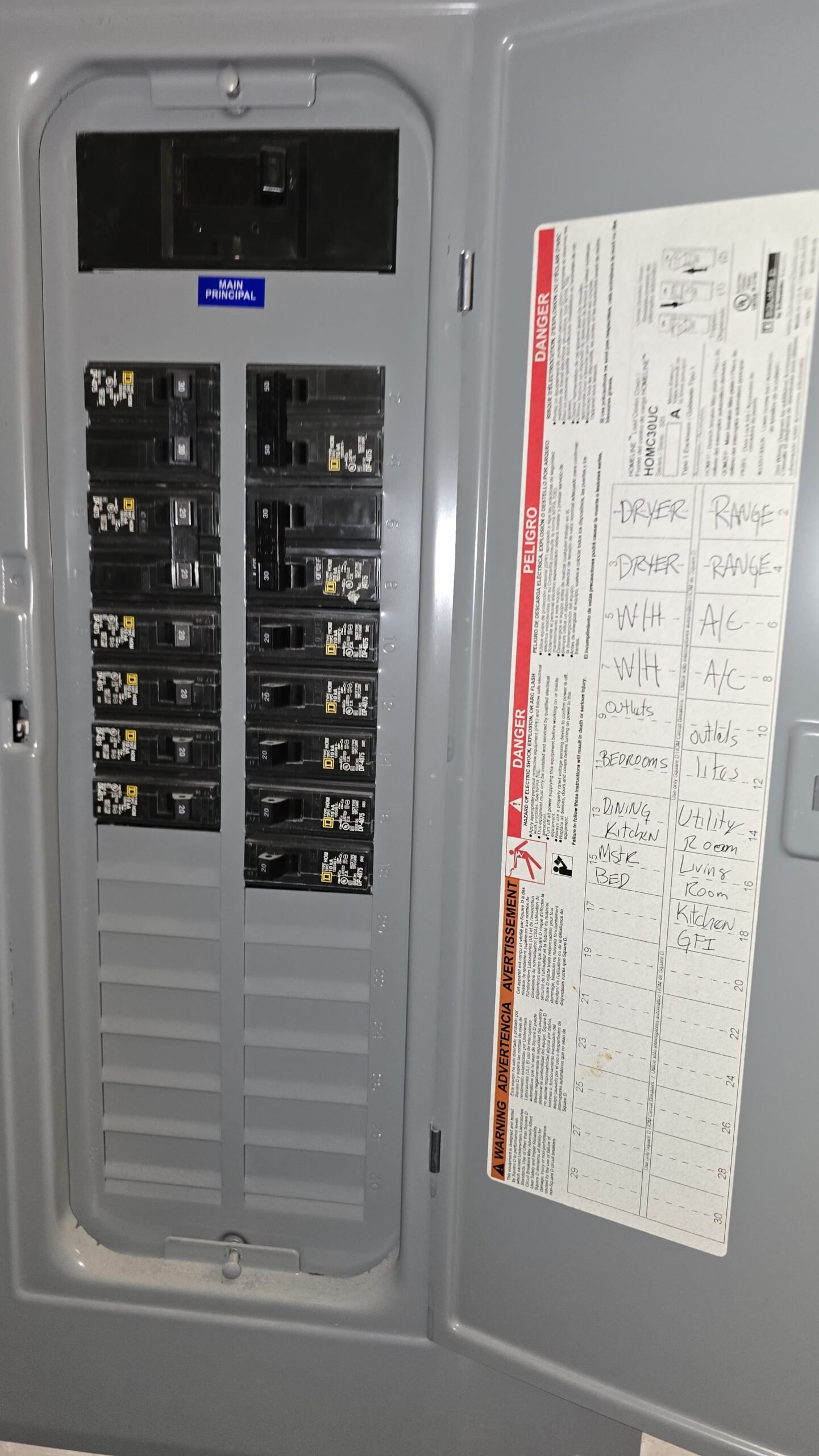 Labeled circuits in open electrical panel, Tampa, FL 33613.
