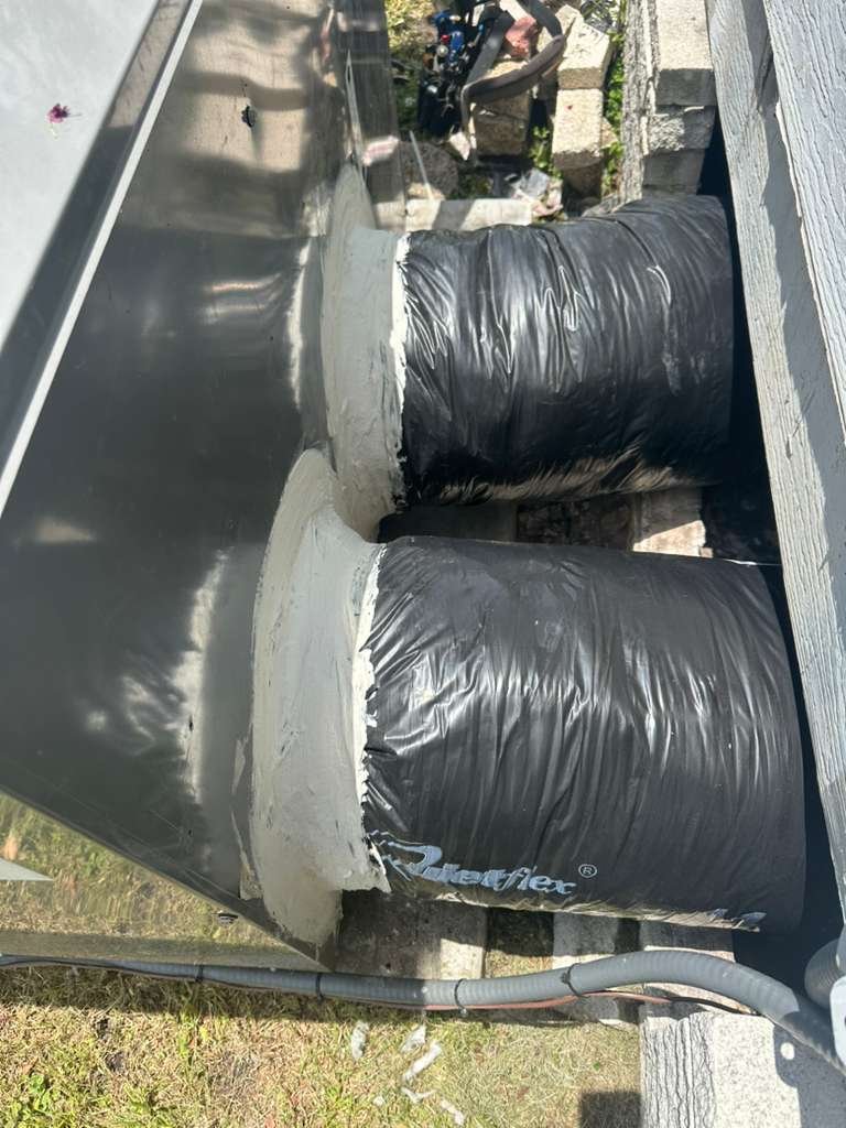 Sealed ductwork connections on building exterior in Plant City, FL 33565.
