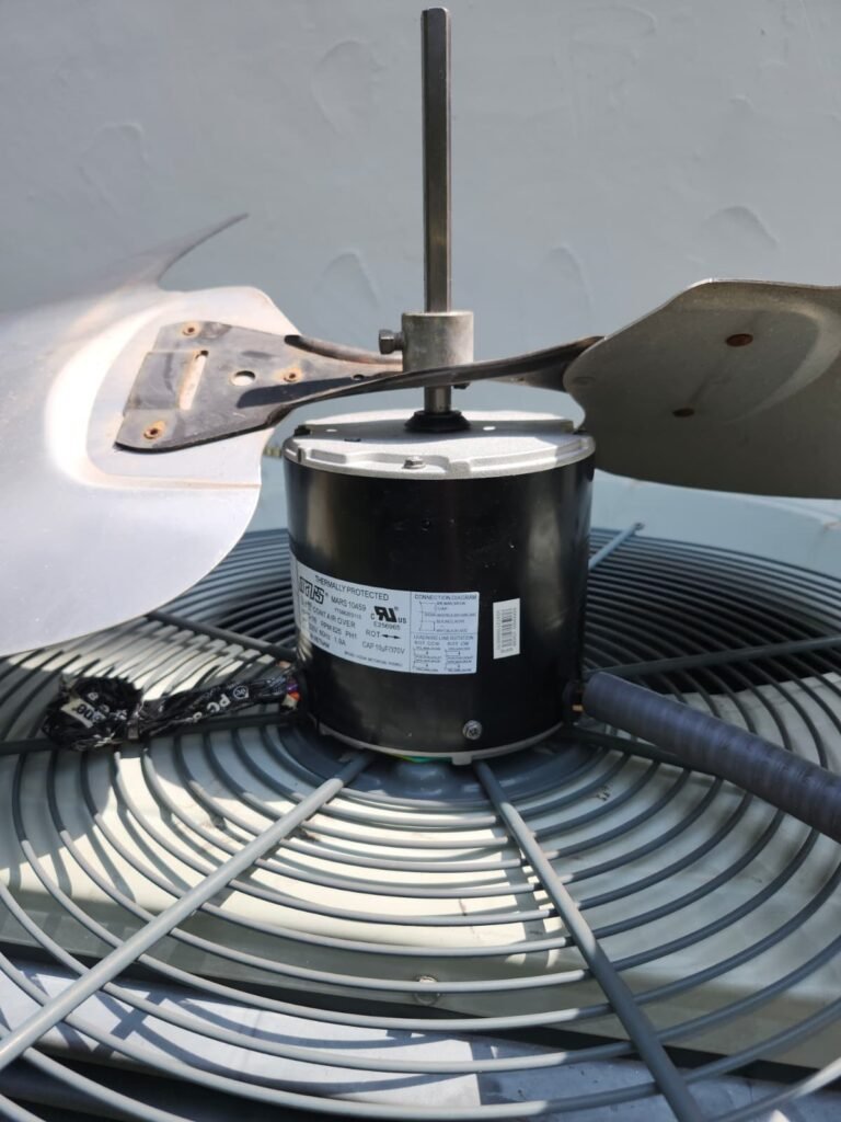 In-progress fan motor installation on HVAC unit in Tampa, FL 33609