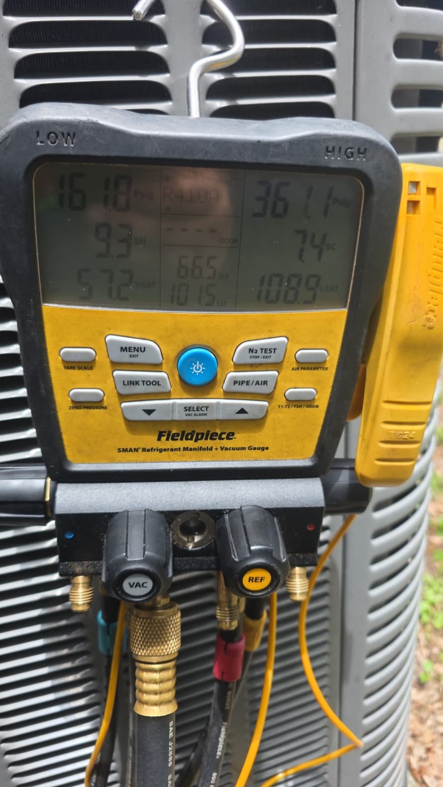 Fieldpiece Gauge on AC Unit - New Port Richey, FL 34655 Fieldpiece manifold gauge attached to AC unit in New Port Richey, FL 34655 for TXV replacement.