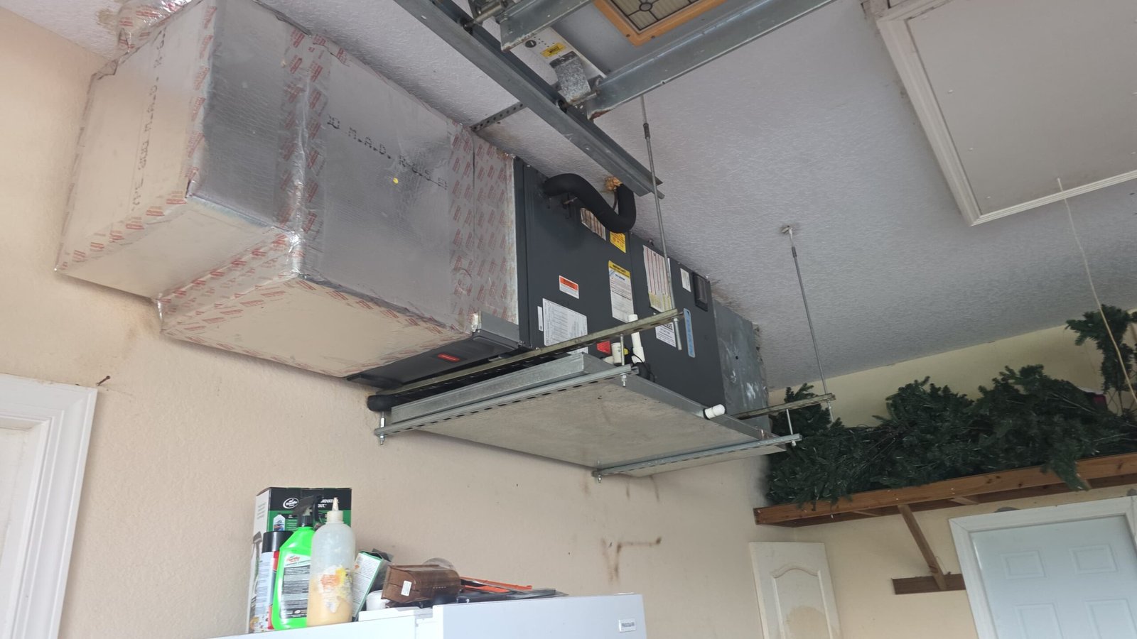 HVAC unit with ductwork in garage ceiling, Elite Therapy Visit #7, Bradenton, FL 34202.