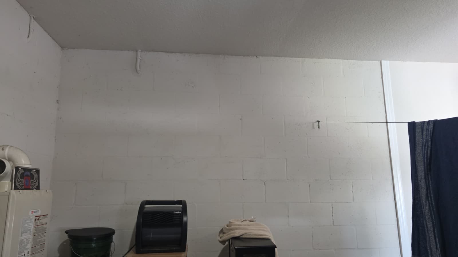 Garage Wall Before AC Install - Riverview, FL 33579 Empty garage wall space before AC installation in Riverview, FL 33579.