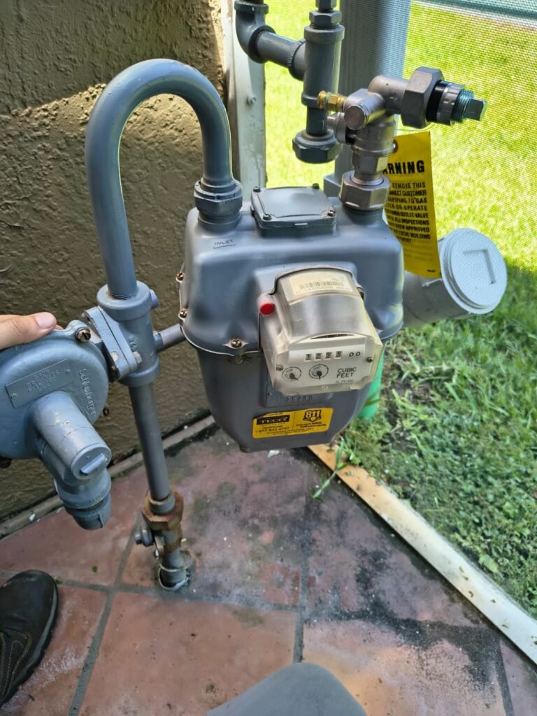 Gas meter with pressure gauge in gas leak repair, Tampa, FL 33611