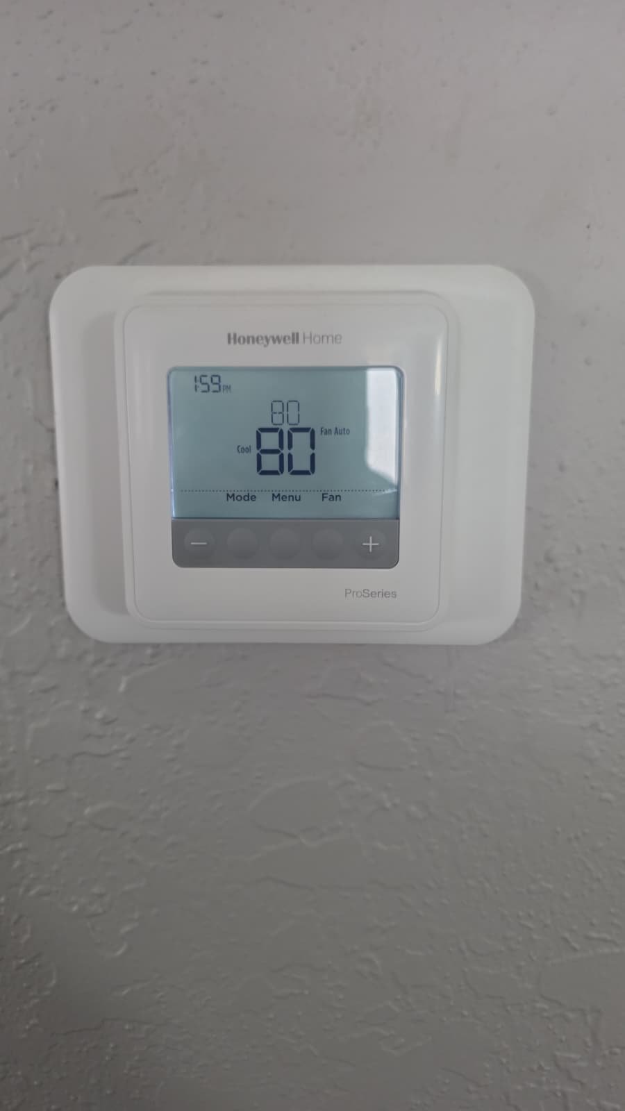 Honeywell Thermostat Display - Largo, FL 33773 Honeywell thermostat on wall showing temperature in Largo, FL 33773.