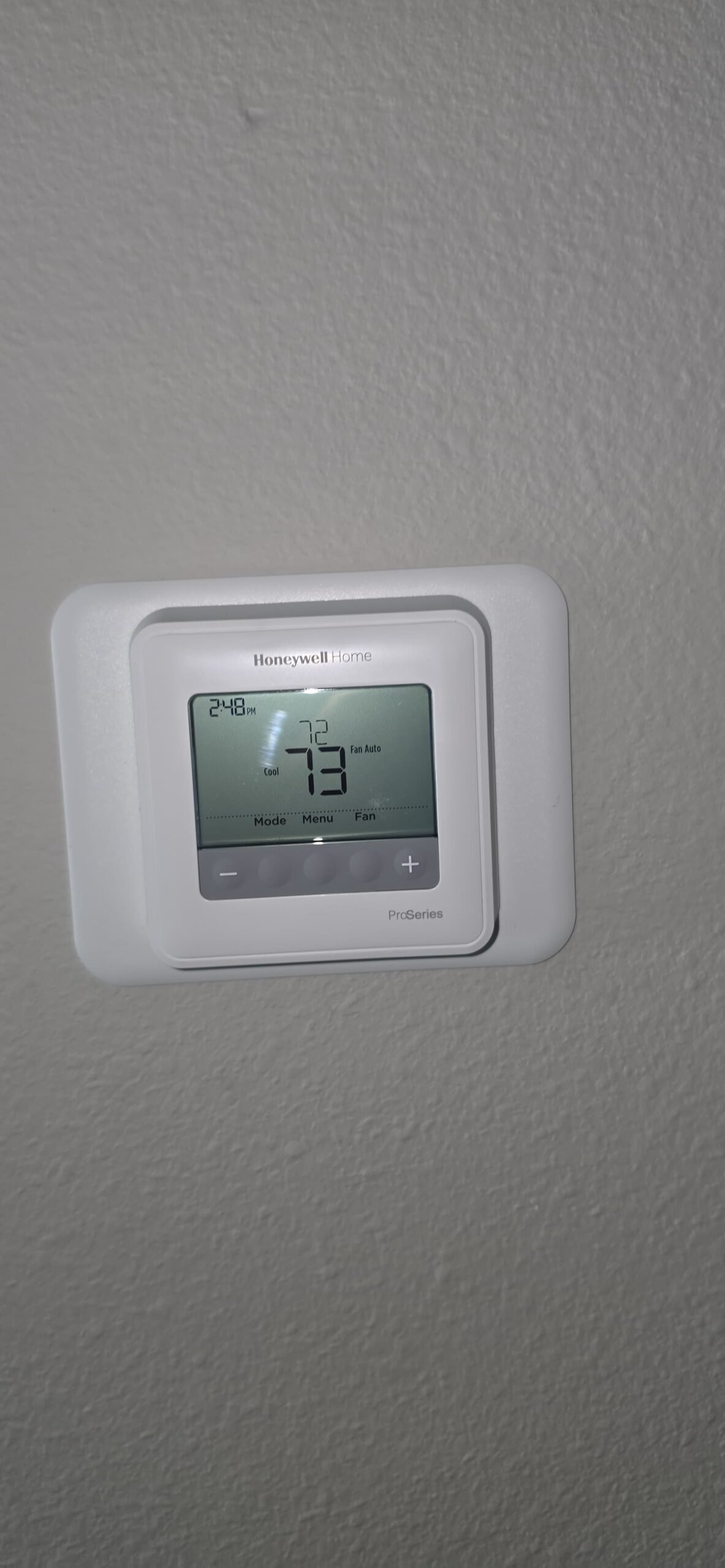 Honeywell Thermostat Display - Spring Hill, FL 34609 Close-up of Honeywell thermostat displaying 73°F in Spring Hill, FL 34609.