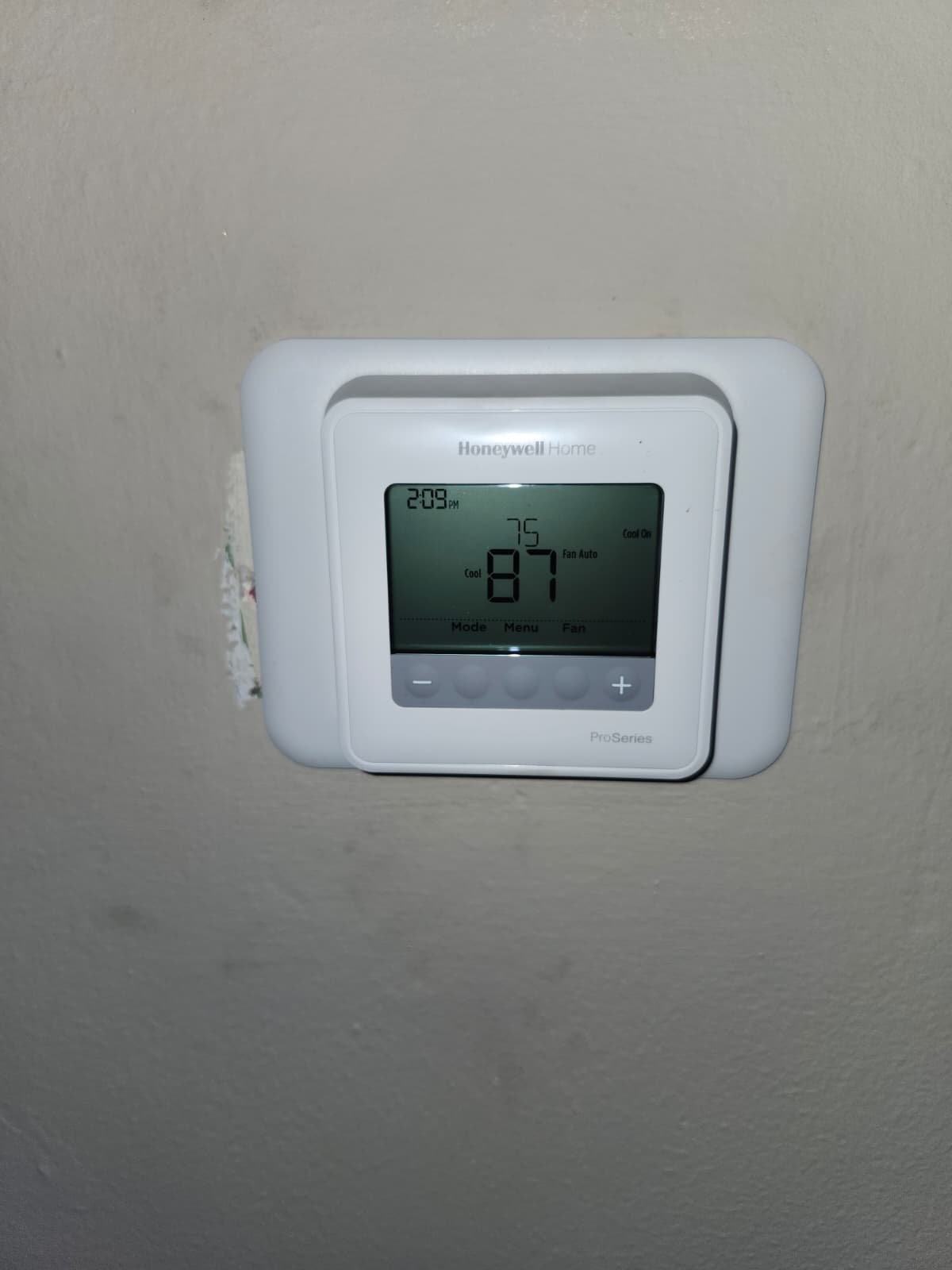 Installed Honeywell thermostat on wall in Tampa, FL 33607.
