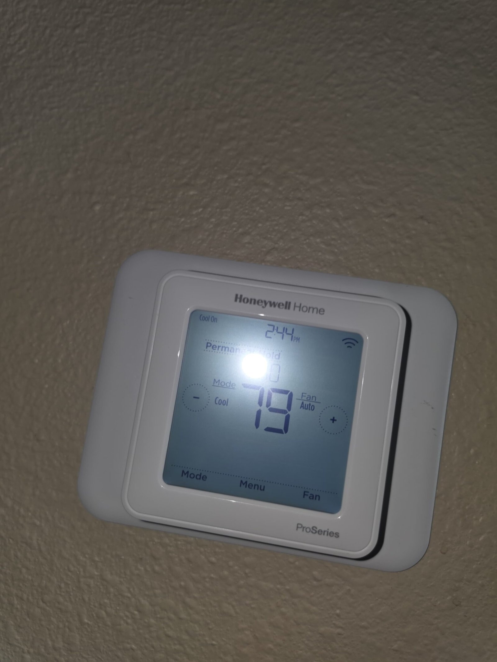 Honeywell thermostat with temperature settings, Land O Lakes, FL 34638.